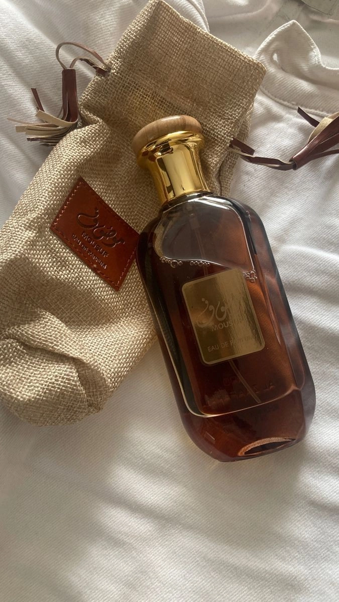 عطر موصوف قهوه ای ارض الزعفران